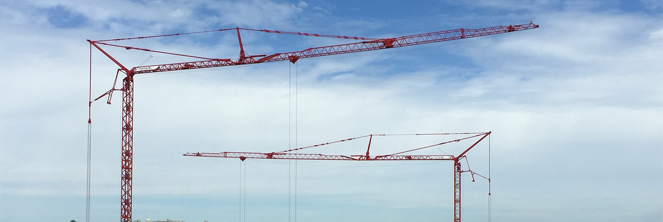 Banner displaying Potain self-erecting cranes